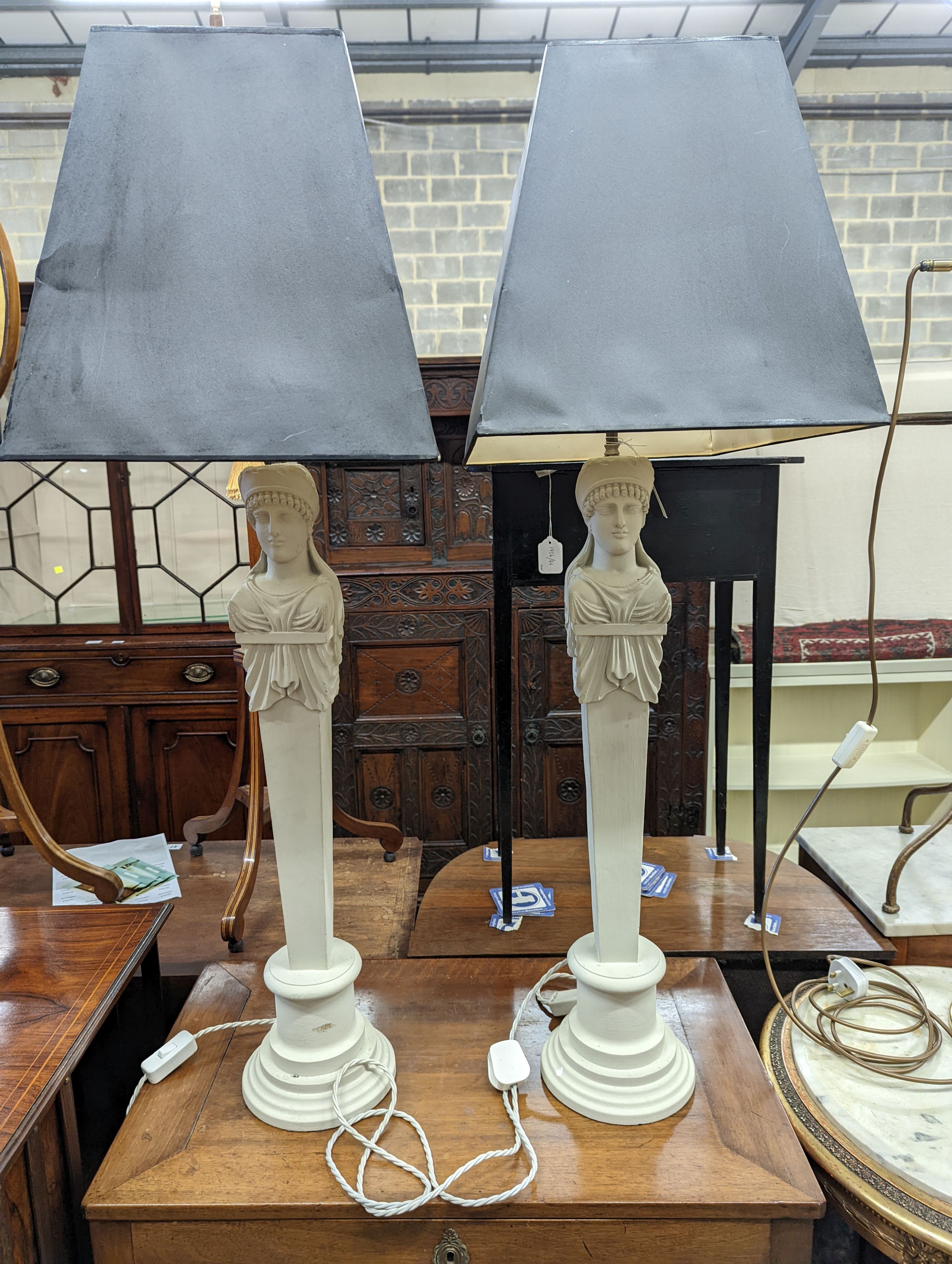 A pair of painted wood figural table lamps, height excluding shades 76cm